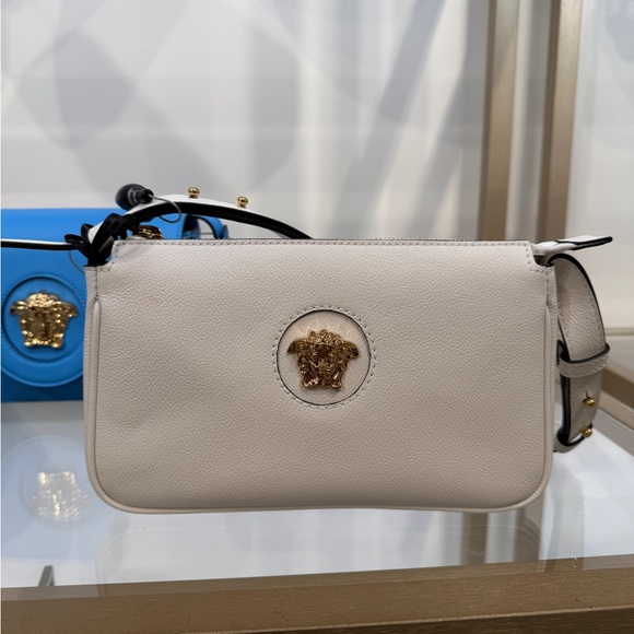 Versace Handbags - Versace Cream Crossbody Bag with Gold Medusa Emblem